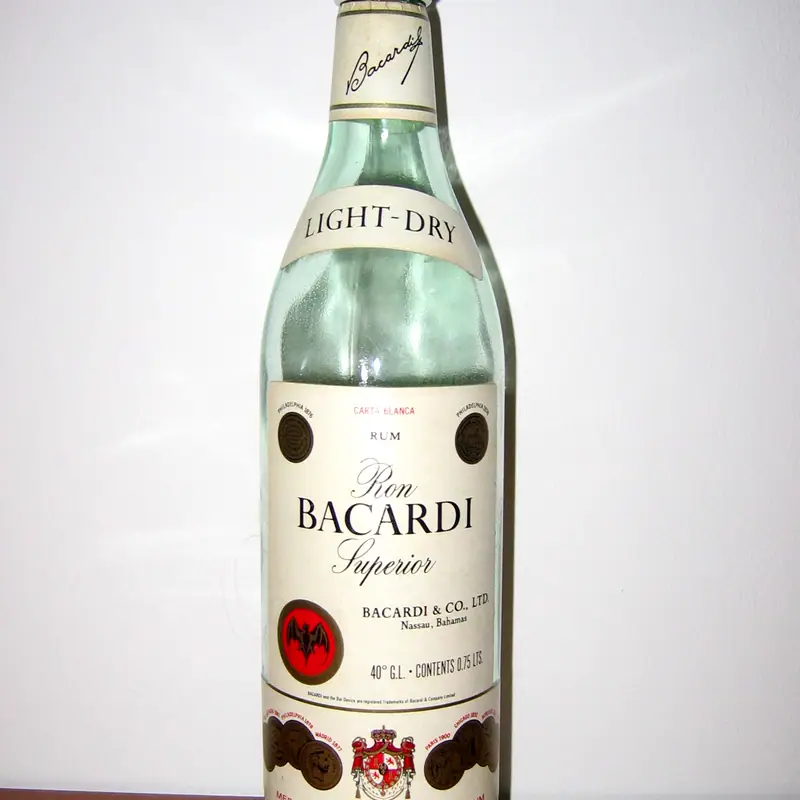 A bottle of light-dry white Bacardi rum on a wooden shelf